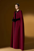 I.H.F ruby crepe and Lyon velvet strapless gown with a bustier top and long cape for elegant evening wear.