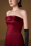 Red ANAMAYA crepe silk lined strapless bustier gown by I.H.F, featuring a sleek column silhouette and elegant design.