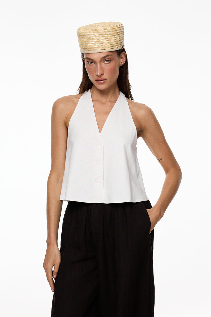 Light beige straw pillbox hat by Le Sh Ka featuring a classic, structured design perfect for stylish summer looks.