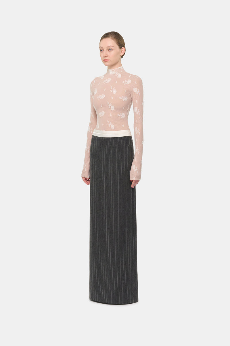 Gray striped Jacques maxi skirt by Montsand, flowing fabric with a stylish pattern, shown on a model.
