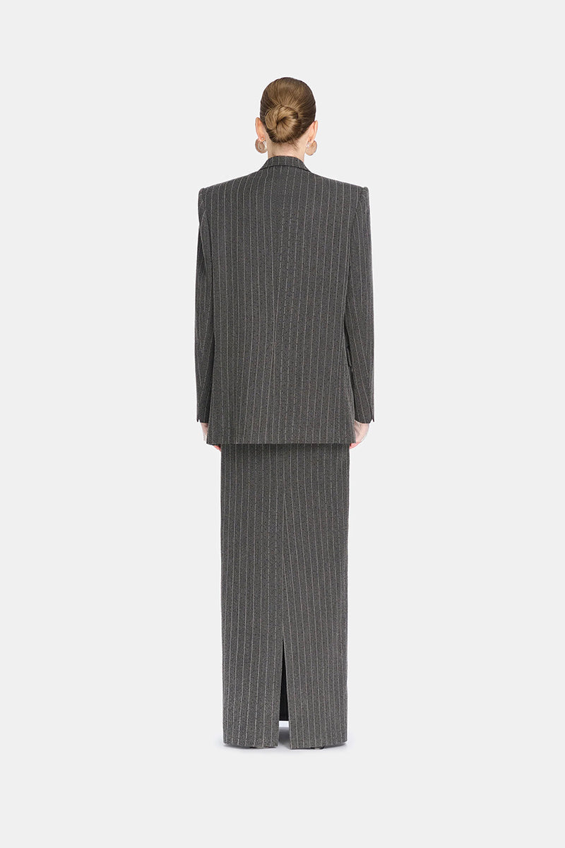 Montsand striped Jacques maxi skirt with bold vertical stripes, flowy fabric, and high waist design.