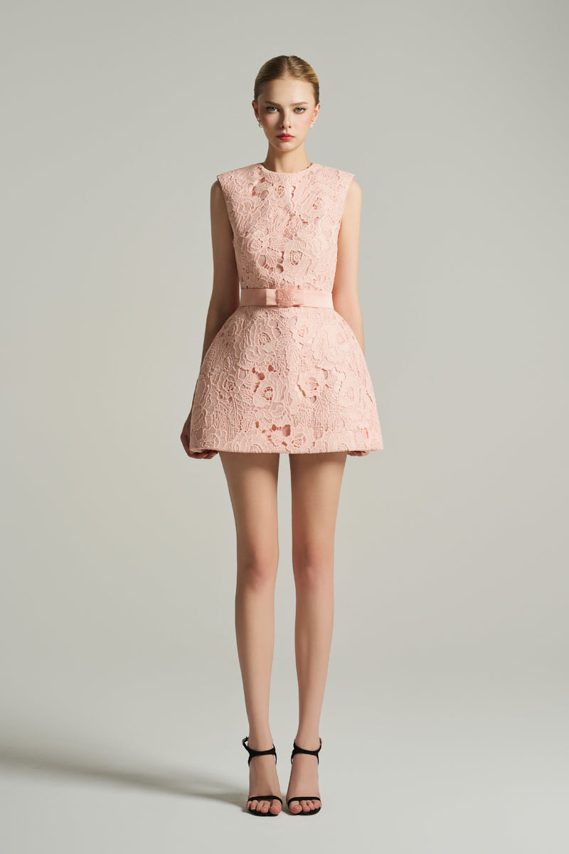 Light pink sleeveless bell mini dress by I.H.F Studio featuring puff hips and a crystal-embellished bow belt.