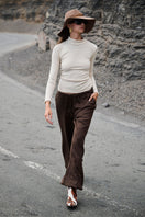 Nelblu KAIA beige top, stylish sleeveless blouse with a relaxed fit, showing the soft fabric and simple neckline.