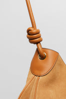 Beige suede boho shoulder bag from Folklore The Label with a casual, relaxed design and natural texture.