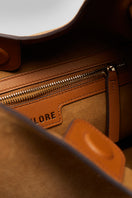 Beige suede boho shoulder bag by Folklore The Label with a relaxed, stylish design and natural suede texture.