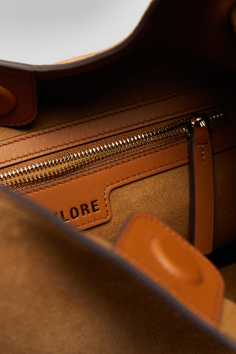 Beige suede boho shoulder bag by Folklore The Label with a relaxed, stylish design and natural suede texture.