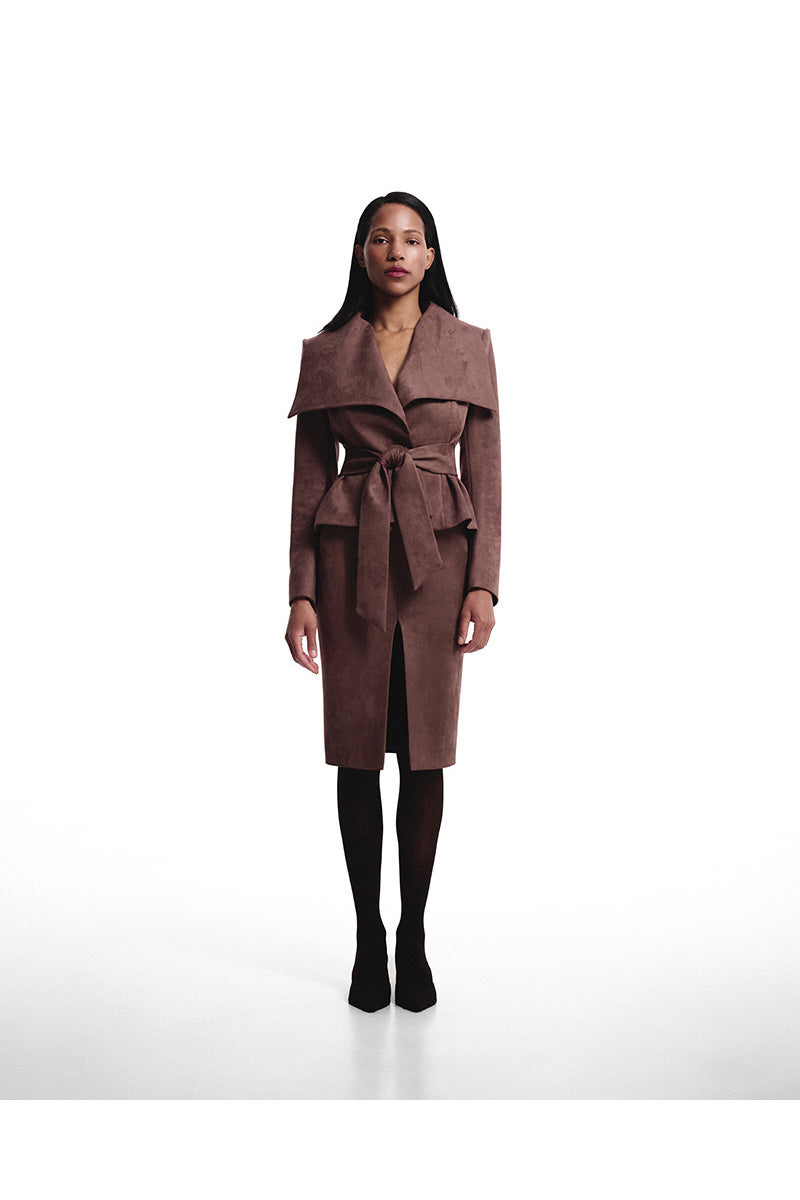 Brown suede midi skirt by Kris Marán, showing its soft texture and stylish flow on a model.