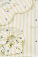 Yellow summer fruits sleeping gift box by MANITO, featuring a cozy home-themed presentation with vibrant fruit illustrations.