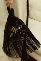 Sarah's Bag black velvet slip bag with fringes, top handle design featuring a sunrise pattern on the front.