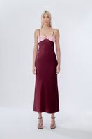 Stolen Stores Swan Slip Maxi Dress in burgundy with pink accents, flowing fabric, and sleeveless design, perfect for elegant occasions.