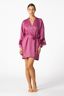 NK IMODE Sydney Seaside Short Silk Kimono in Freesia, lightweight robe with floral pattern, displayed hanging on a wooden hanger.