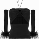 Black cut-out top with interchangeable sleeves from JC Pajares, featuring a stylish design and modern silhouette.