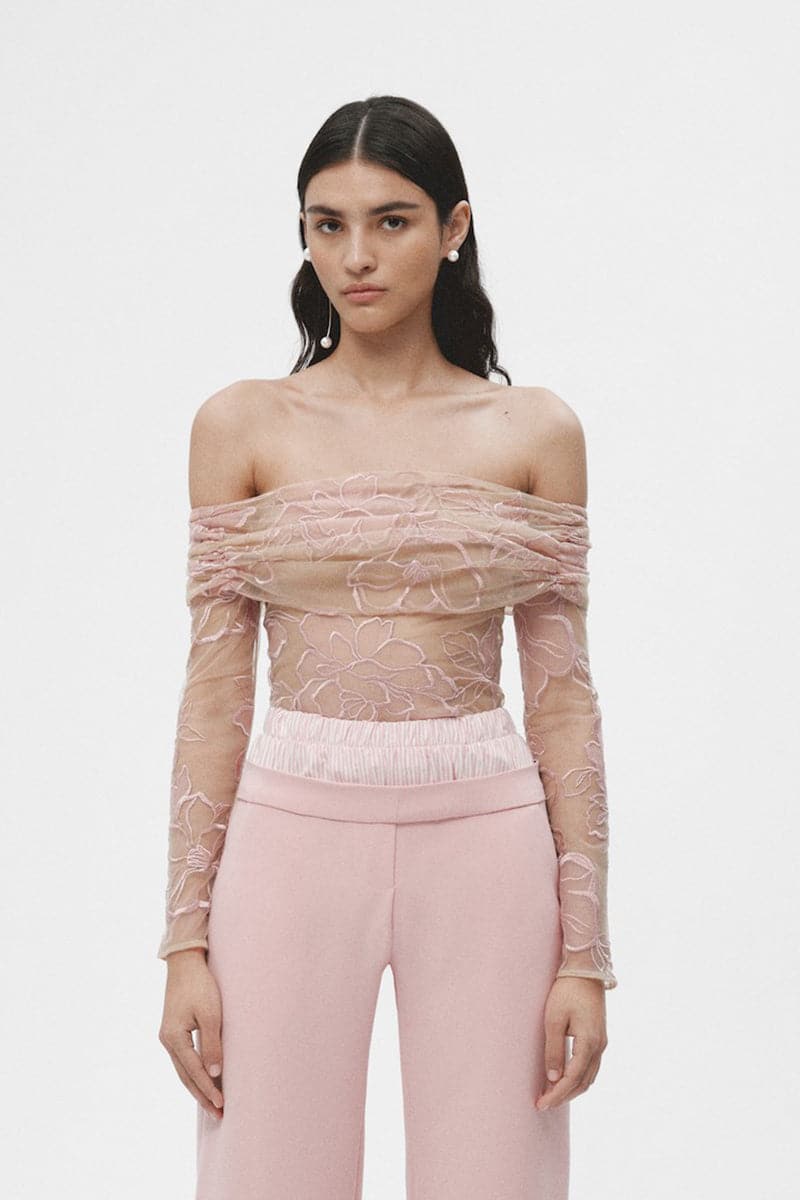 Pink sheer lingerie top by JC Pajares, featuring delicate, lightweight fabric with soft ruffle details and adjustable straps.