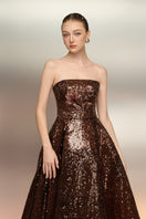 Brown BUNAFSA sequin gown by 21Six with intricate sequin details and elegant design, shown on a mannequin.