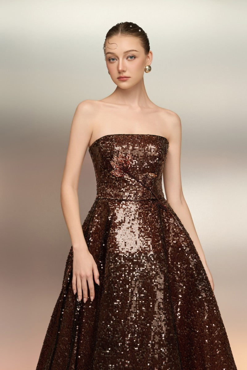 Brown BUNAFSA sequin gown by 21Six with intricate sequin details and elegant design, shown on a mannequin.