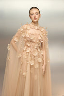 Beige tulle flower gown by 21Six featuring delicate floral details and flowing fabric, perfect for elegant occasions.