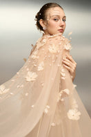 Beige Rumram tulle flower gown by 21Six with floral embellishments and flowing fabric, perfect for elegant occasions.
