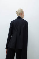 TAGG wool jacket with a detachable scarf, featuring a stylish design and cozy fabric, shown with the scarf attached.