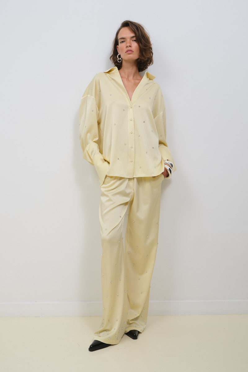 Oversized TAGG shirt with intricate crystal embroidery, featuring a relaxed fit and elegant design.