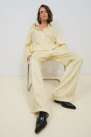 Tagg oversized shirt with crystal embroidery, featuring a relaxed fit and decorative crystal details on soft fabric.