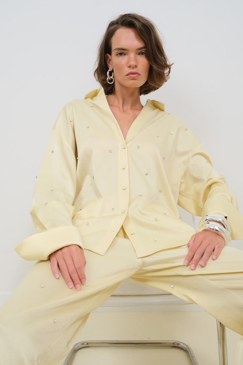 TAGG oversized pants with crystal embroidery, showcasing a relaxed fit and intricate sparkling details.