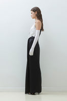 Elegant TAGG satin maxi dress with lace trim and a knot detail, featuring a flowing silhouette and delicate fabric.