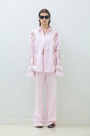 Pink TAGG pants with elastic waistband, casual and comfortable fit, shown on a model.