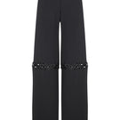 Pair of JC Pajares pants with metal chain accents, featuring a stylish and trendy design with a relaxed fit and detailed stitching.