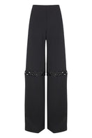 Pair of JC Pajares pants with metal chain accents, featuring a stylish and trendy design with a relaxed fit and detailed stitching.