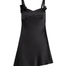 Scarlett Gasque black mini slip dress named Temptation Mini Slip Dress, front view showing sleek fabric and stylish design.