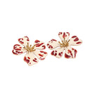 Sara & Flora Butter Aurora Maxi Earrings featuring large, elegant gold-toned earrings with intricate detailing.