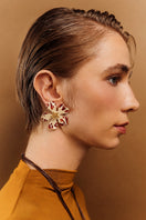 Sara & Flora Butter Aurora Maxi Earrings featuring elegant gold-toned design with intricate detailing and a statement size.