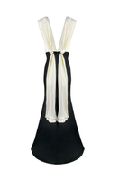 Maylé Vásquez Chavon black and white gown with elegant design, featuring intricate patterns and a flowing silhouette.