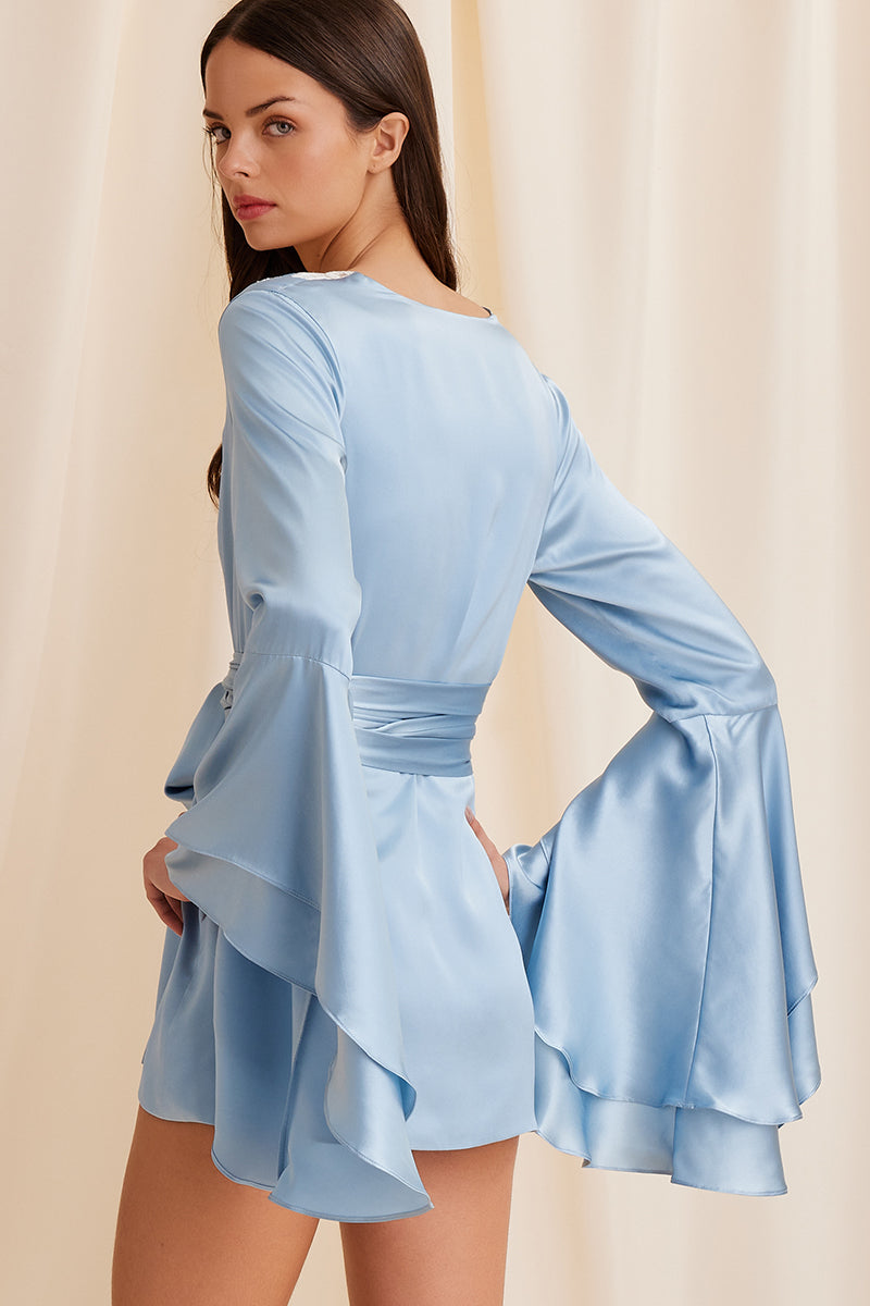 Blue Scarlett Gasque The Darling Robe hanging on a wooden hook, soft fabric and relaxed fit, stylish loungewear for women.