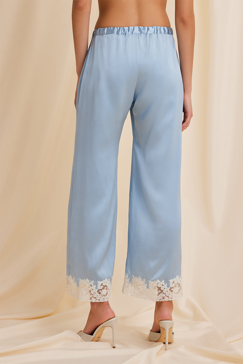 Back view of Scarlett Gasque The Jayne Pant in blue, stylish pants with a tailored fit and clean design.