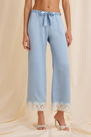 Front view of Scarlett Gasque The Jayne Pant in blue, showcasing stylish, tailored pants with a smooth fabric finish.