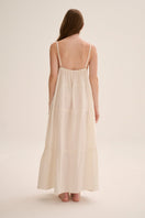 Nelblu Tiempos dress in ecru, a stylish maxi dress with flowing fabric and elegant design, perfect for casual or formal wear.
