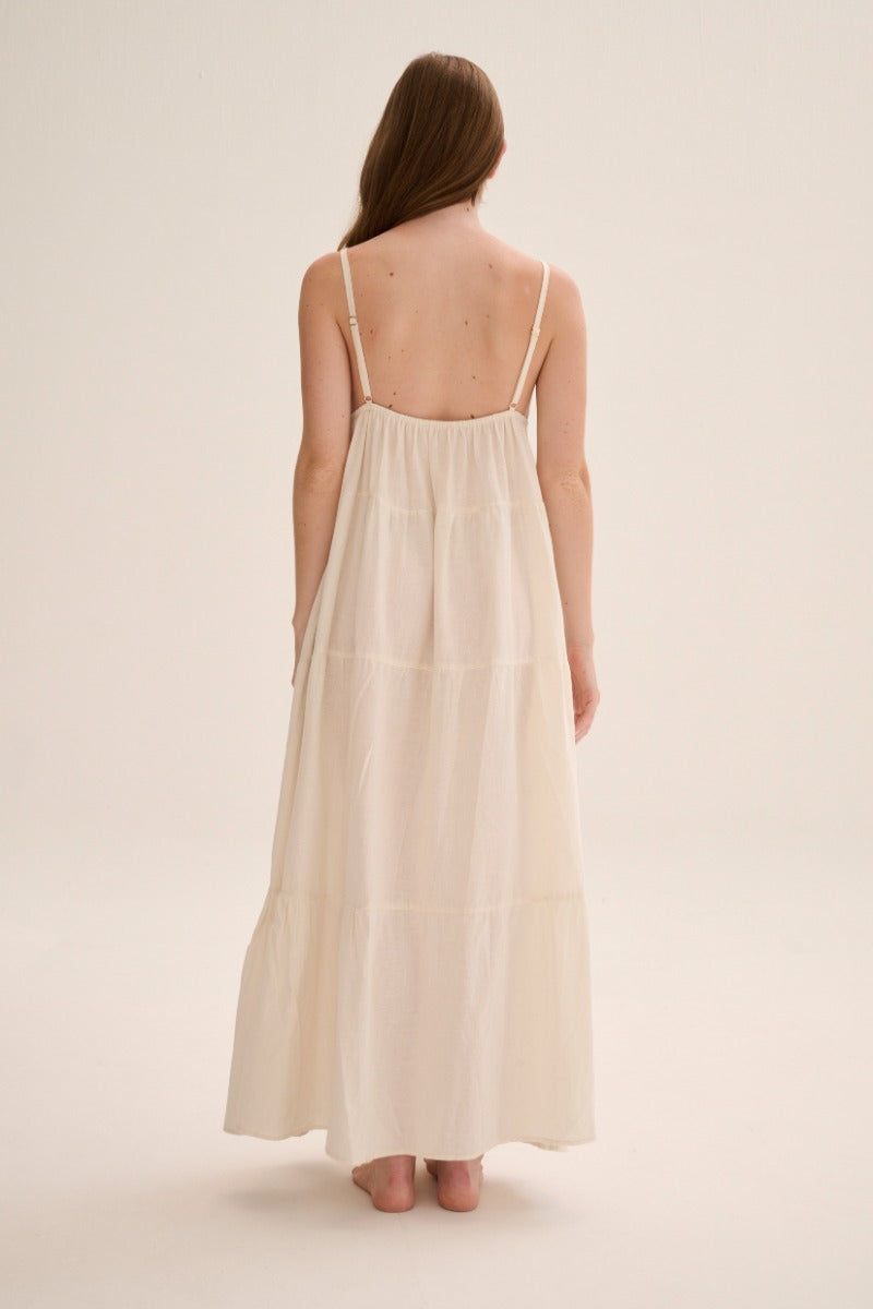 Nelblu Tiempos dress in ecru, a stylish maxi dress with flowing fabric and elegant design, perfect for casual or formal wear.