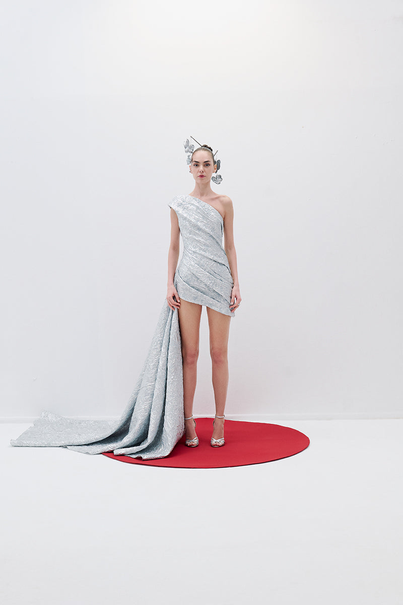 ONE-SHOULDER DRAPED MINI DRESS WITH TAIL IN SILVER - CULT MIA