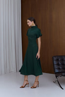 Deep green Tori structured midi dress by UNDRESS, showcasing a fitted bodice and flowing skirt in a stylish, elegant design.