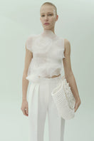 White translucent flower blouse with pleated details by NADYA DZYAK, featuring delicate floral fabric and elegant design.