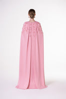 Pink velvet satin cape gown by Tracy Studio, featuring flowing fabric and elegant design, perfect for formal occasions.