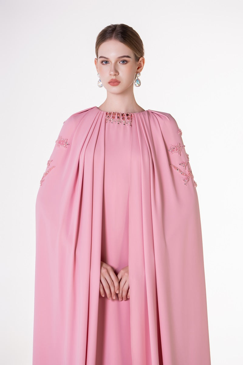 Pink velvet satin cape dress by Tracy Studio, elegant maxi dress with flowing fabric and luxurious texture.