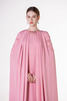 Pink velvet satin cape gown by Tracy Studio, elegant floor-length dress with flowing fabric and luxurious texture.