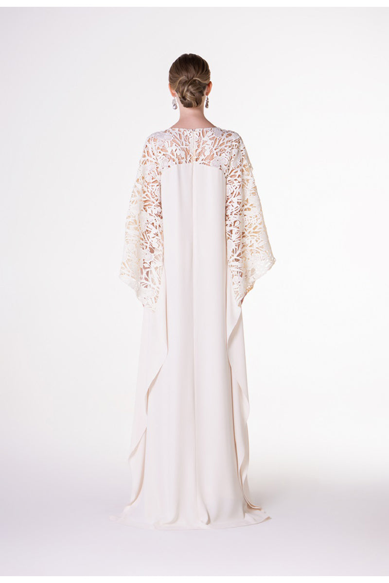 Off-white satin maxi dress with floral sleeve details by Tracy Studio, flowing fabric and elegant design.