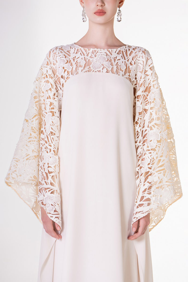 Off white satin maxi dress with floral sleeve details from Tracy Studio, elegant and flowing for sophisticated occasions.