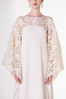 Off-white satin gown with floral sleeve details by Tracy Studio, elegant evening dress with intricate floral accents.