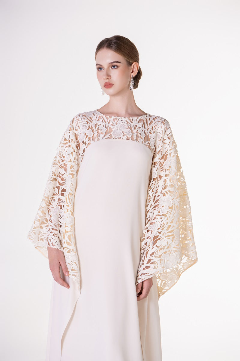Off-white satin maxi dress with floral sleeves by Tracy Studio, featuring a flowing silhouette and elegant design.