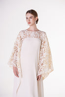 Off-white satin gown with floral sleeves by Tracy Studio, elegant evening dress with delicate floral details.