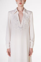White V-neck satin maxi dress by Tracy Studio, flowing fabric and elegant design perfect for formal occasions.